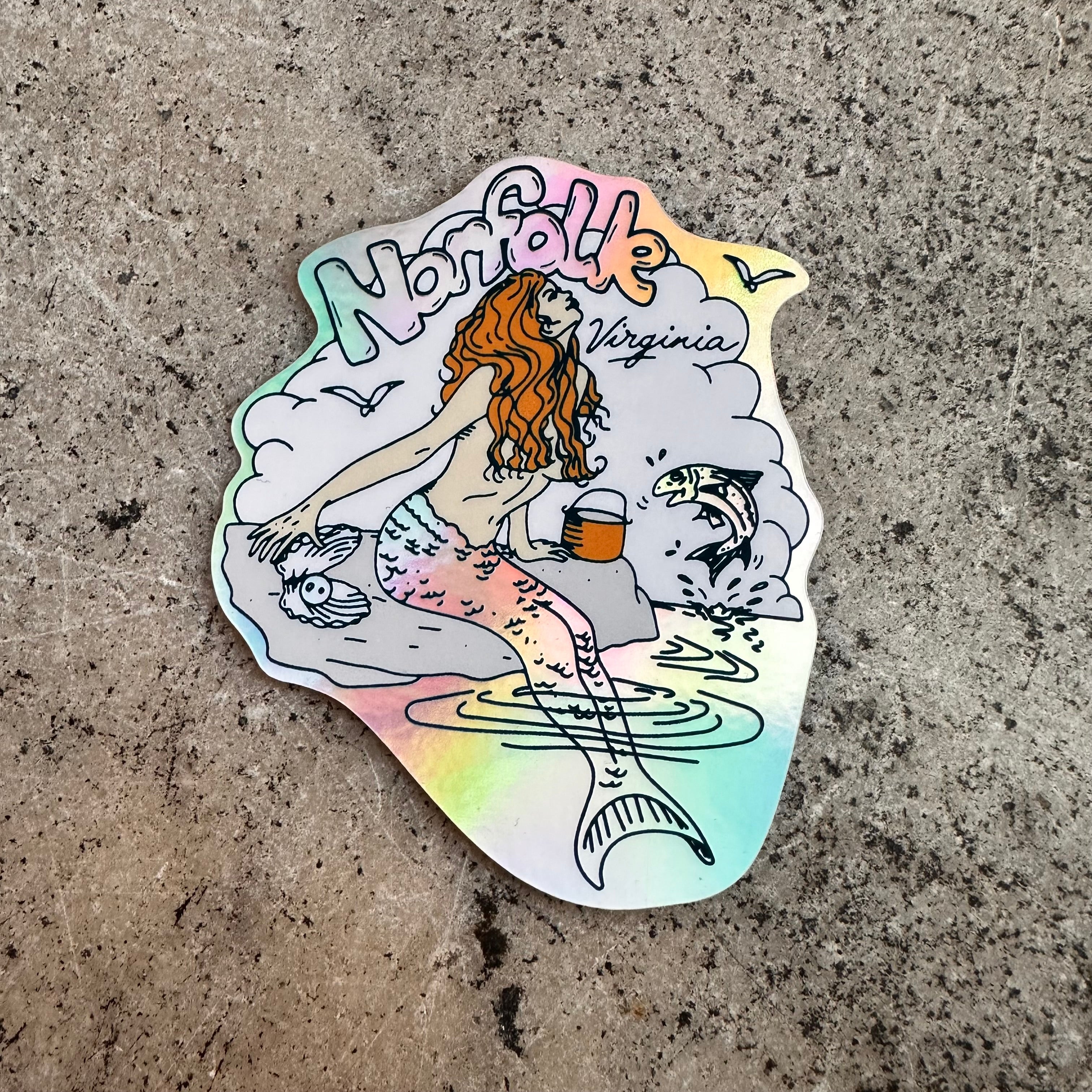 Screen printed holographic sticker of a retro mermaid and "Norfolk Virginia" in the background.