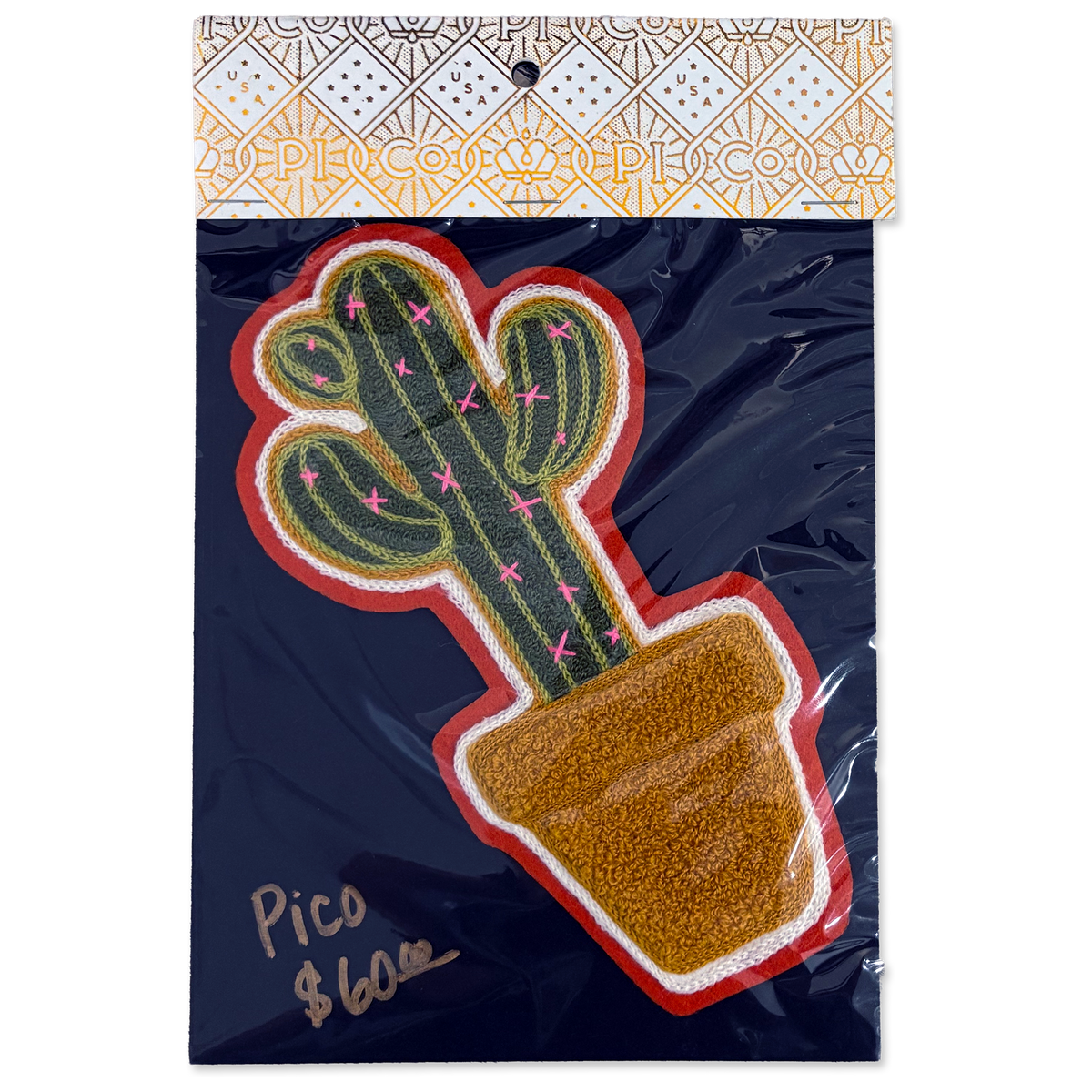A packaged decorative patch featuring a green cactus in a brown pot with a red and white border, attached to a dark navy backing card with a patterned header. Handwritten text on the card reads 'Pico $6.
