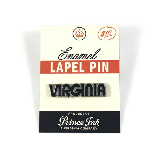 "Virginia" enamel pin in black and silver, mounted on printed backing card.