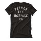 Black tee shirt back with white print "Prince Ink Norfolk VA"