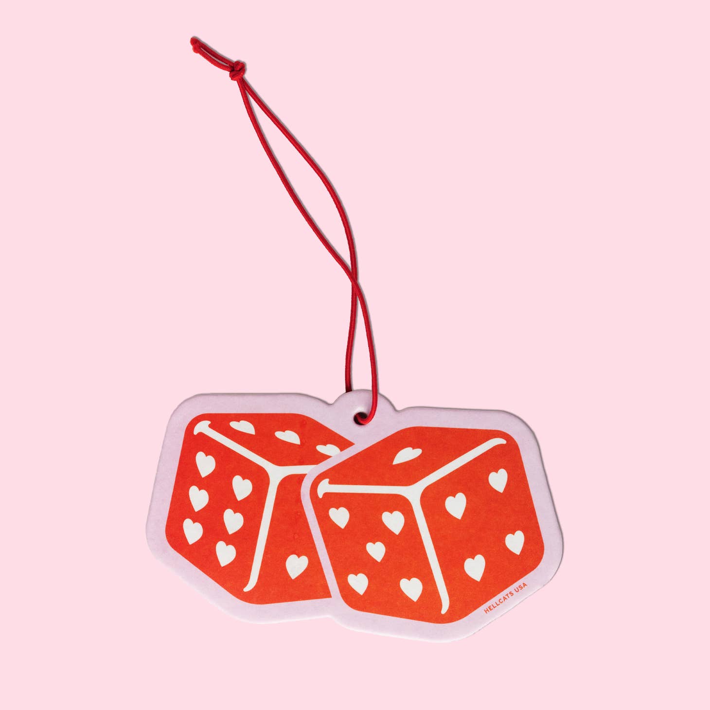 Air Freshener die-cut in the shape of dice with hearts for pips, printed in red and with a red string loop for hanging.