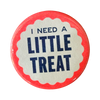 Blue lettering on a pink and white button